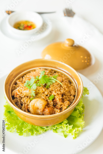 fried rice with shrimp and sausage in clay pot