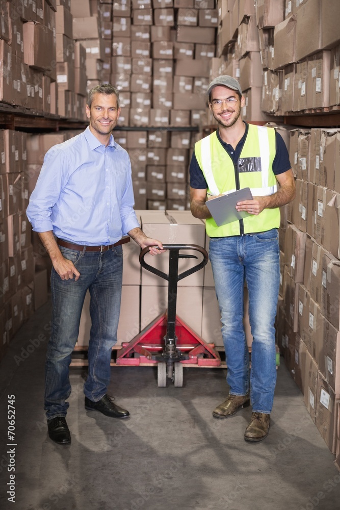 Fototapeta premium Warehouse manager and foreman working together
