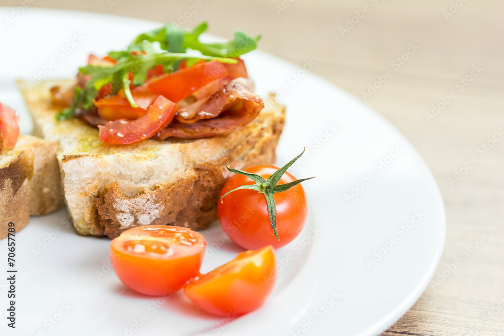 Fresh Bruschetta Sandwich With Bacon, Rucola And Tomatoes Fresh Bruschetta Sandwich With Bacon, Rucola And Tomatoes