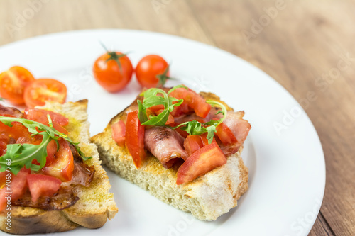 Fresh Bruschetta Sandwich With Bacon, Rucola And Tomatoes
