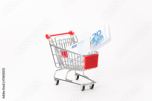 Caddy for shopping with money stack © Studio_3321