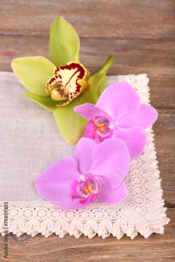 Pink tropical orchid flowers on wooden background Pink tropical orchid flowers on wooden background