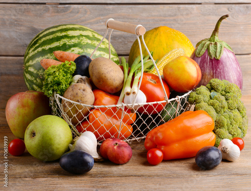 Fototapeta Naklejka Na Ścianę i Meble -  Fresh organic fruits and vegetables on wooden background