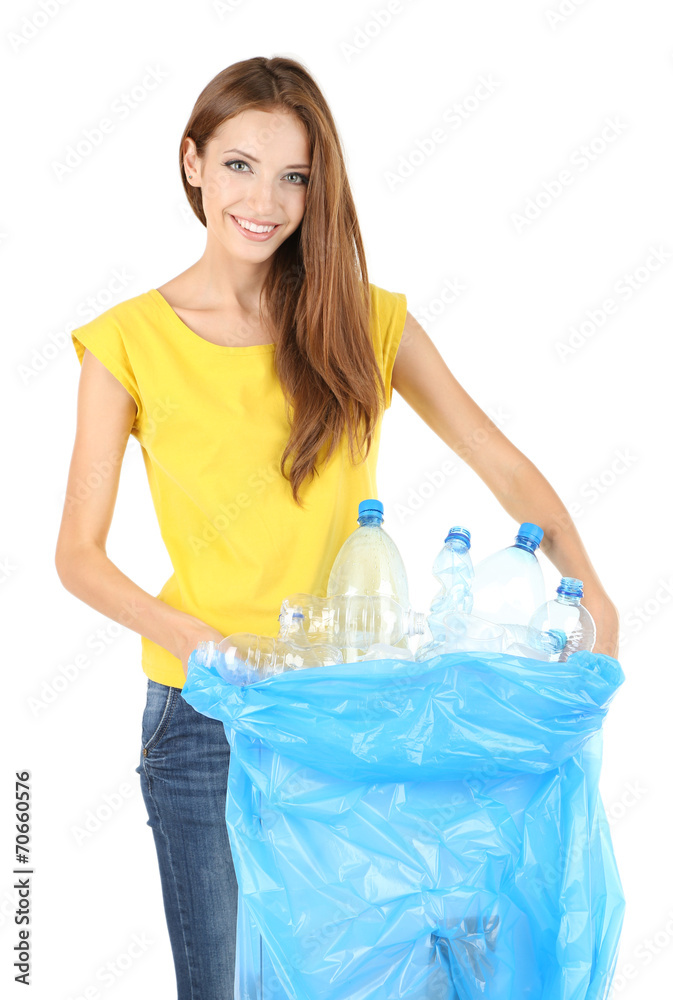 Young girl sorting plastic bottles isolated on white Young girl sorting plastic bottles isolated on white