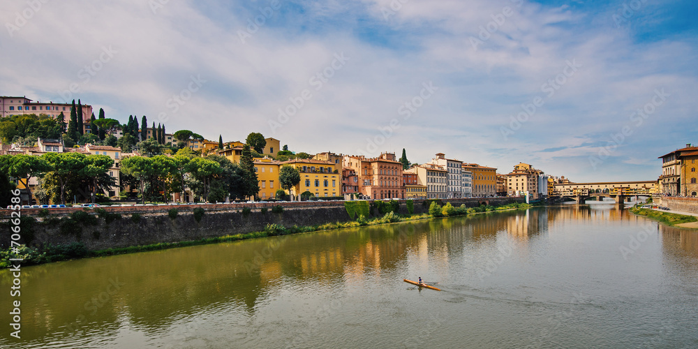 Fototapeta premium Arno river and Ponte Vecchio (Old Bridge) in the background. Flo