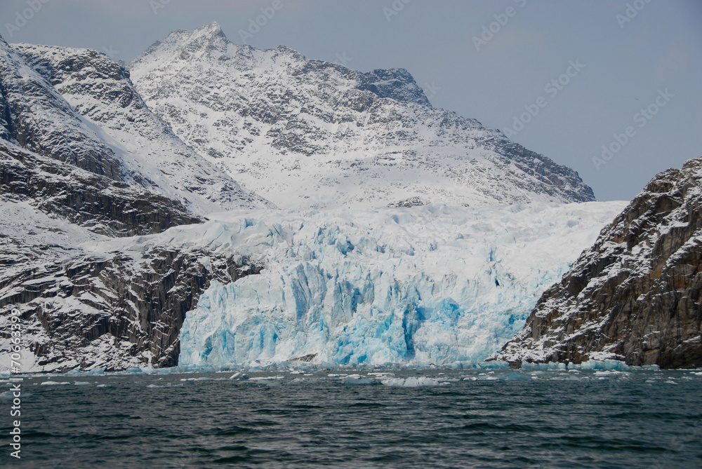 View of mountains and blue icebergs in Greenland