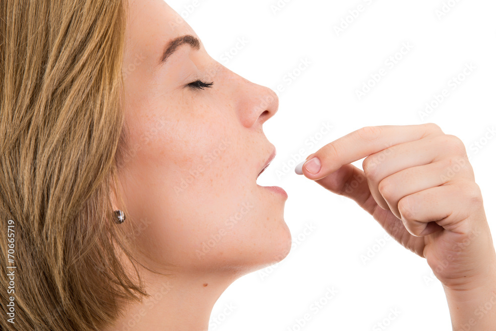 Obraz premium woman taking pill