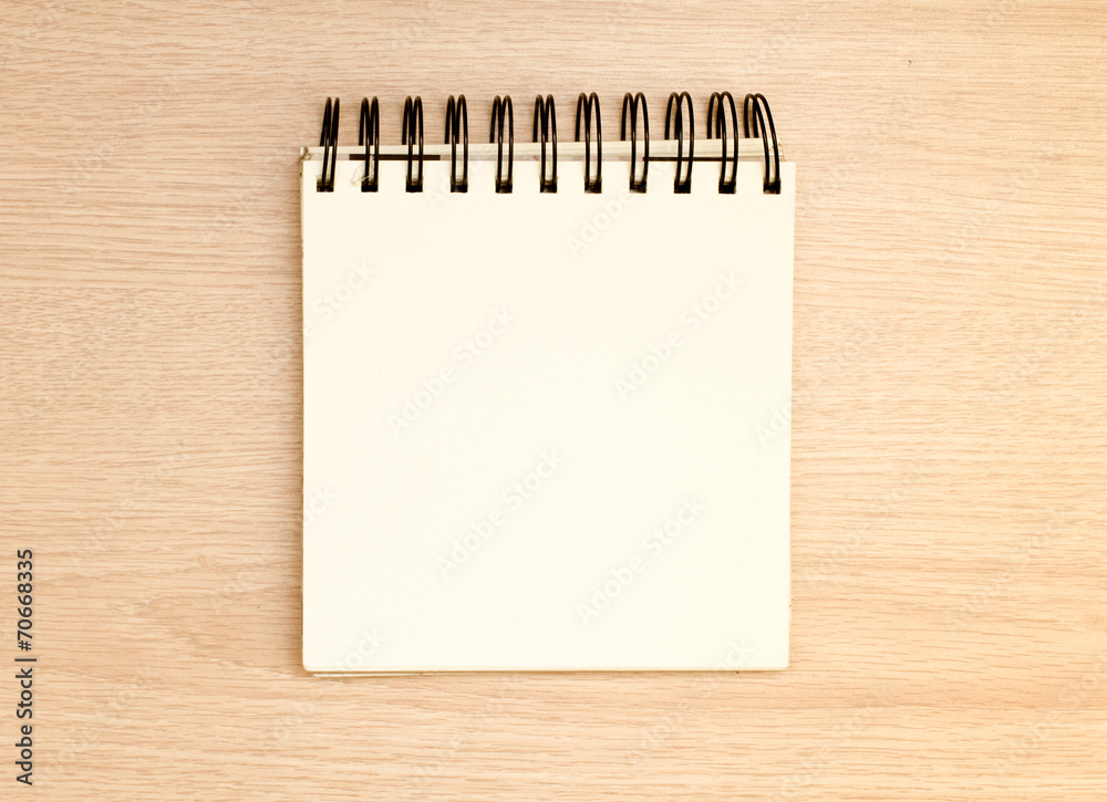 Blank notepad on office wooden table Blank notepad on office wooden table