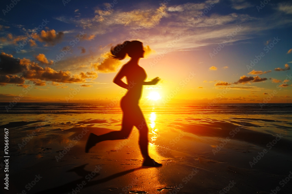 Fototapeta premium Running girl at sunset silhouette