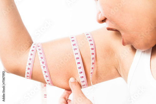 Wallpaper Mural woman checking her upper arm Torontodigital.ca