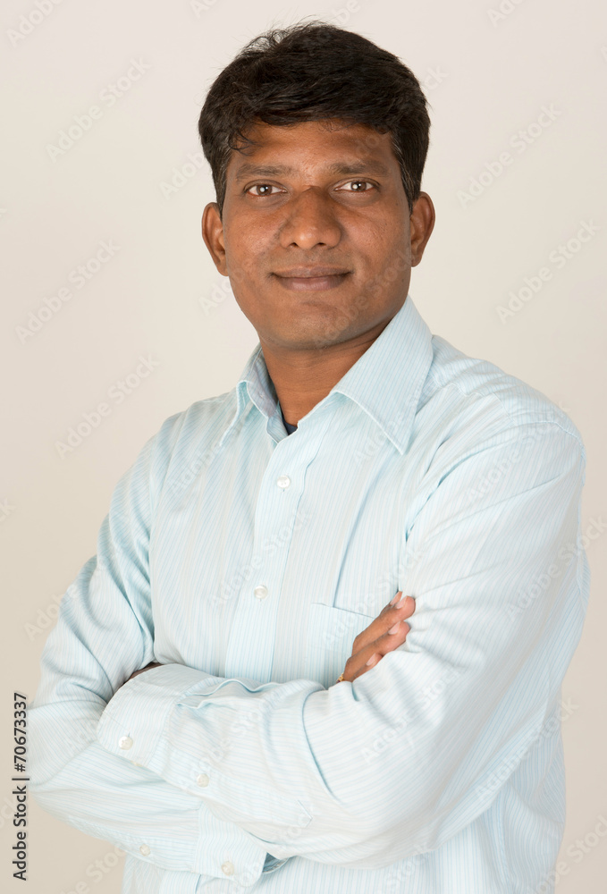 An Indian business executive with folded arms An Indian business executive with folded arms