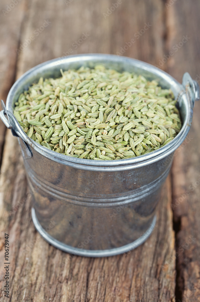 fennel seeds on wooden surface