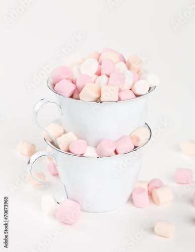 marshmallow in stacked cups isolated on white