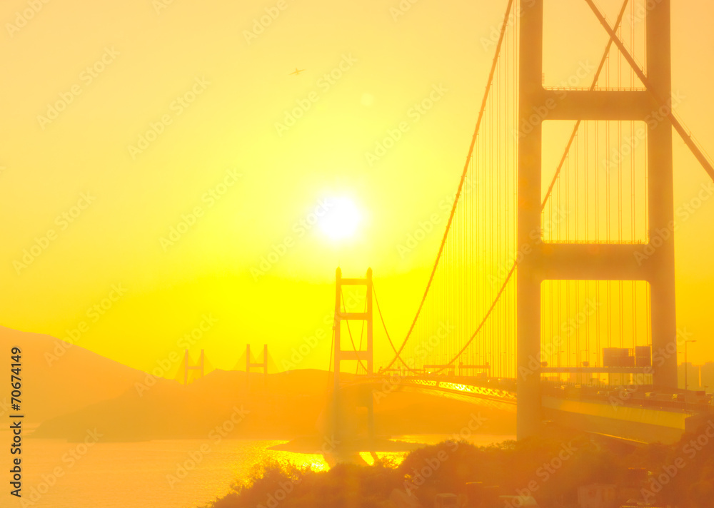 Tsing Ma Bridge in Hong Kong with the sunshine in soft focus