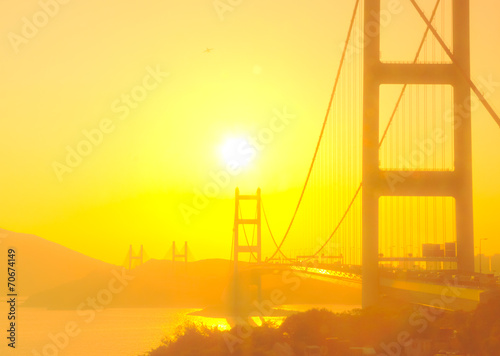 Tsing Ma Bridge in Hong Kong with the sunshine in soft focus