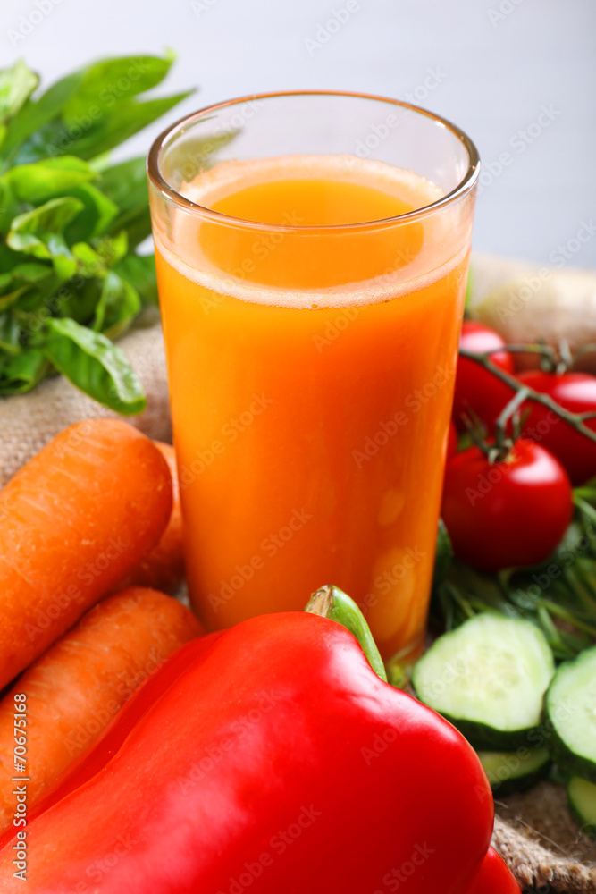Glass of fresh carrot juice and vegetables Glass of fresh carrot juice and vegetables
