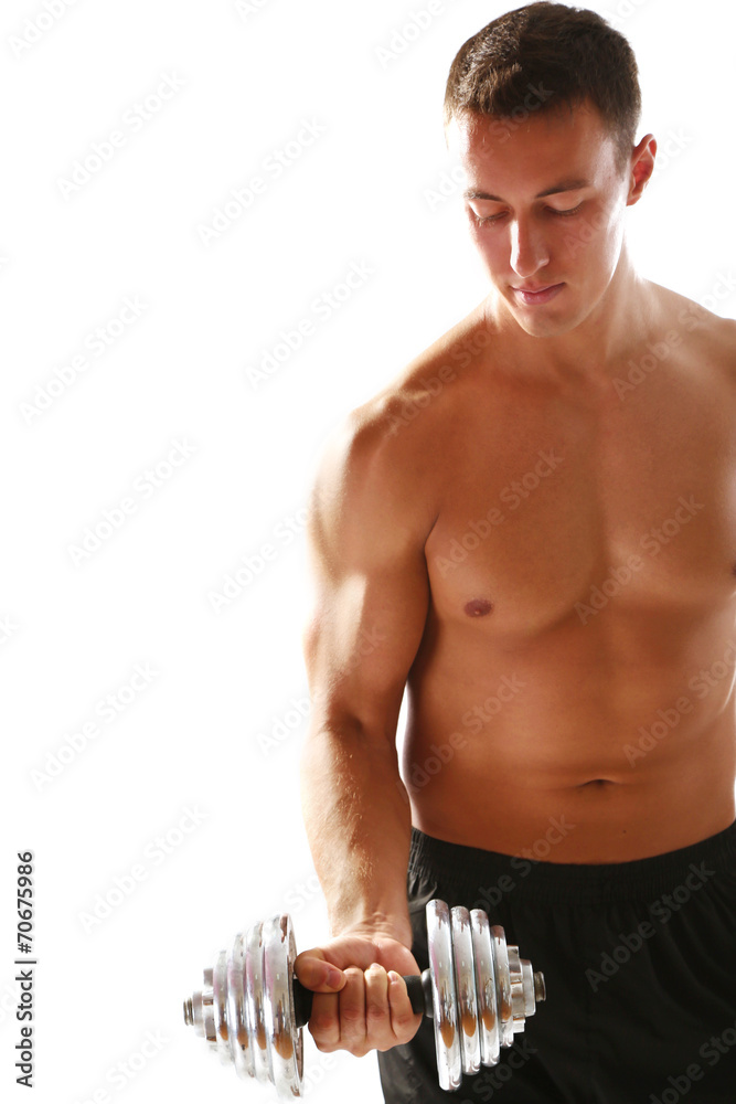 Handsome young muscular sportsman execute exercise with