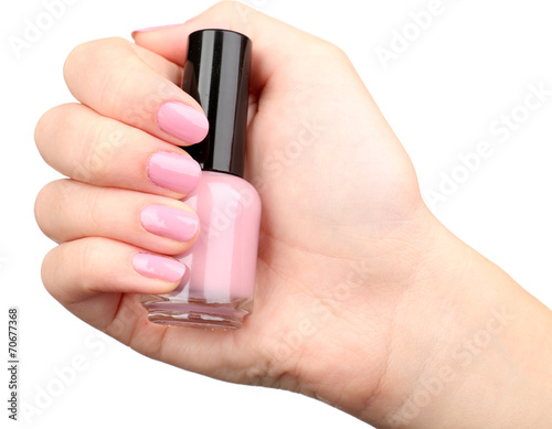 Nail polish in hand, close-up