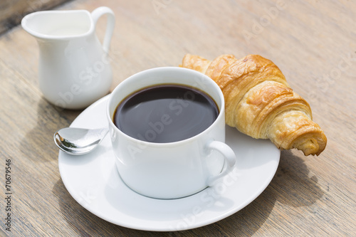 Fototapeta Naklejka Na Ścianę i Meble -  Breakfast with cup of black Coffee and Croissant