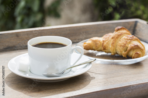 Breakfast with cup of black Coffee and Croissant