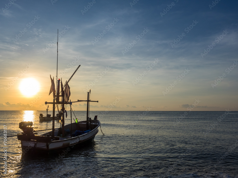 The fishing boat on the sea in the morning.