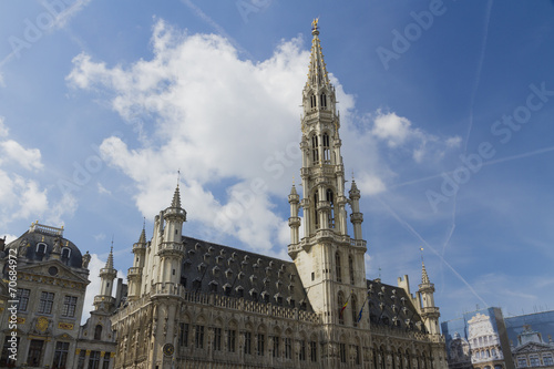 Brussels Town Hall, Grand Place, Belgium. Clouds and blue sky.