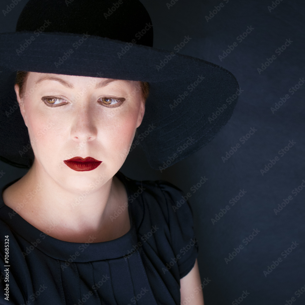 Redhead woman in old navy blue. Red lips. Vintage style Redhead woman in old navy blue. Red lips. Vintage style