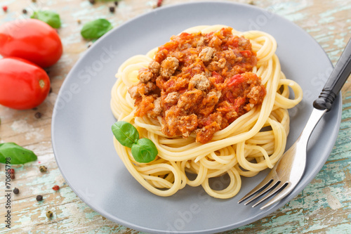 Spaghetti bolognese with basil leave