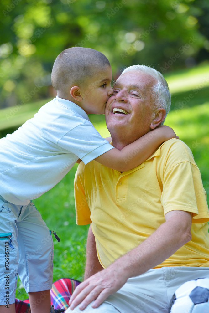 happy grandfather and child in park happy grandfather and child in park