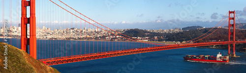 Golden gate bridge and a container ship