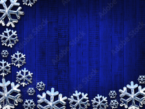 Christmas snowflakes silver and blue wood background