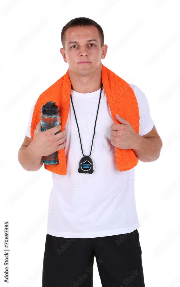 Handsome young sportsman holding towel and bottle with water Handsome young sportsman holding towel and bottle with water