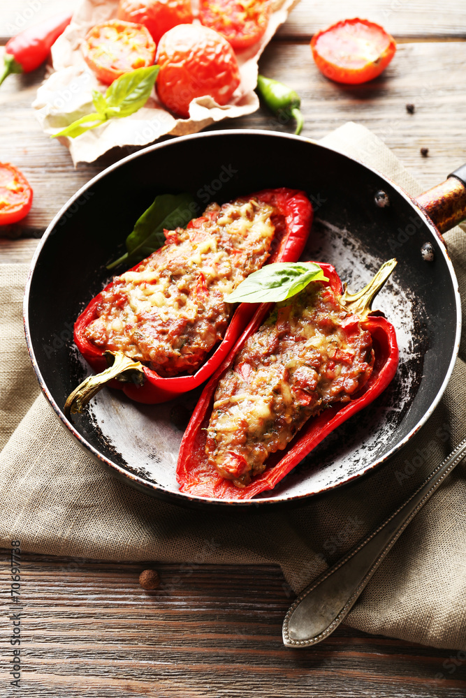 Delicious stuffed peppers in frying pan on table close-up Delicious stuffed peppers in frying pan on table close-up