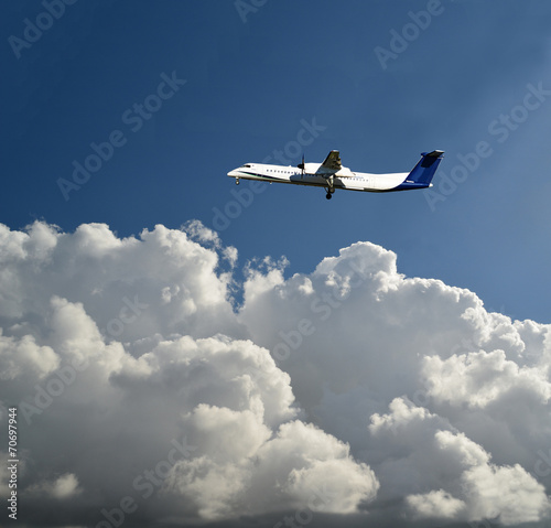 Tableau sur toile Havilland aircraft flying isolated uppon the heavy clouds