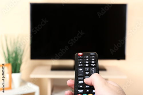 Watching TV and using remote controller