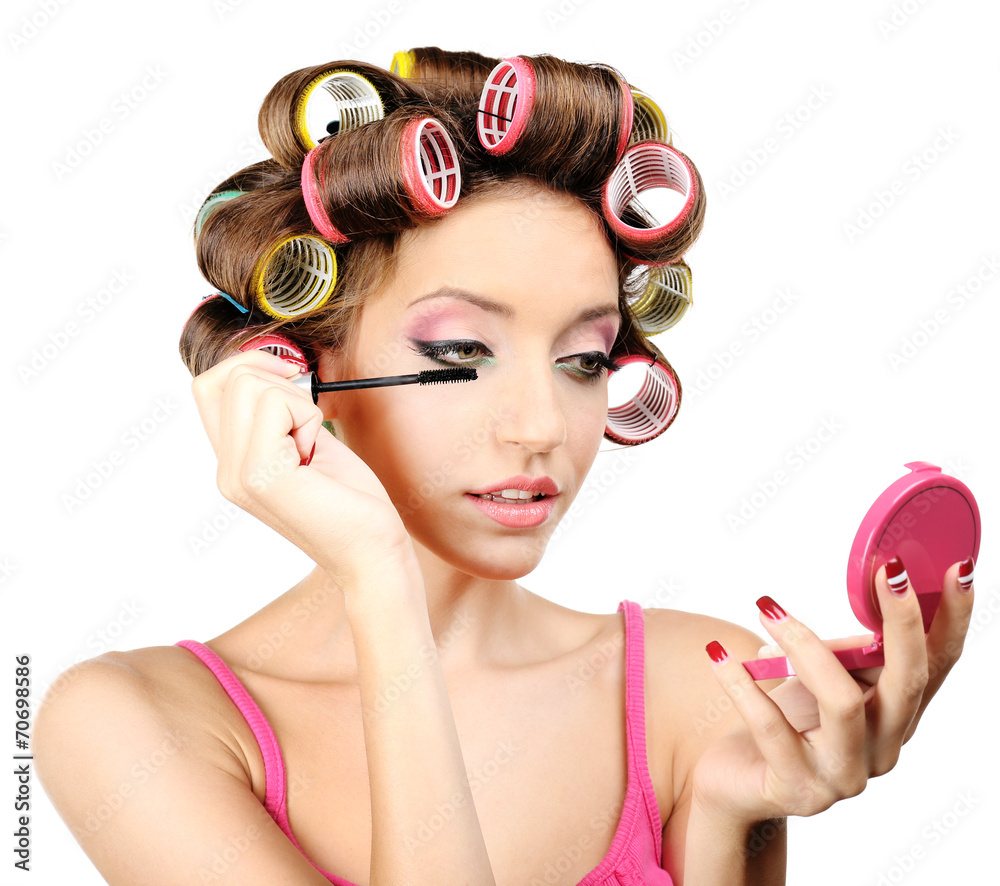 Beautiful girl in hair curlers isolated on white Beautiful girl in hair curlers isolated on white
