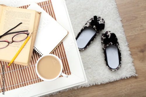 Still life details, cup of coffee, book and glasses