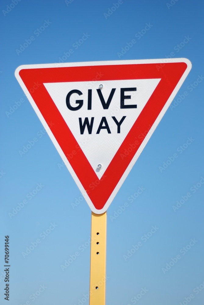 Give way sign in Australia with sky in the background Give way sign in Australia with sky in the background