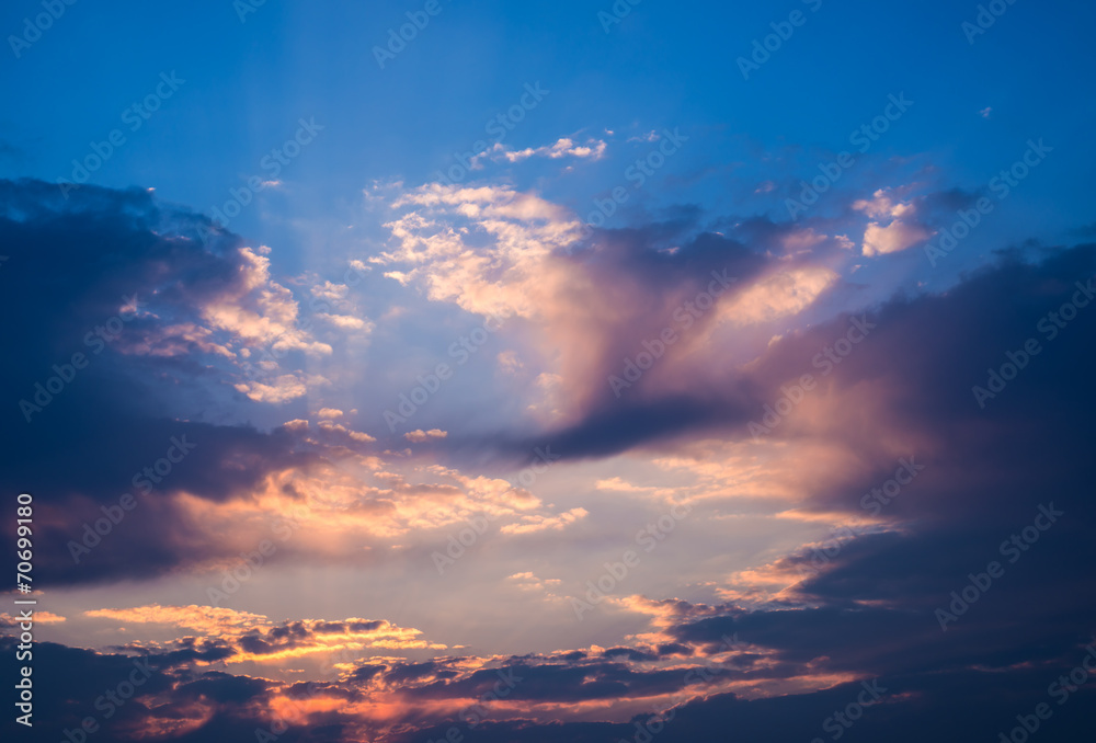 Fototapeta premium Dramatic sunset sky with orange colored clouds.