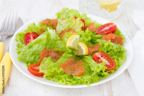 salad with smoked salmon and tomato cherry on plate