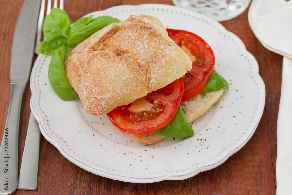 bread with tomato and basil on plate bread with tomato and basil on plate
