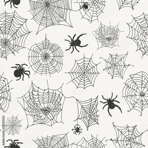 Vector seamless pattern with spiders on a white background