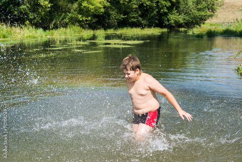 Full 10 years boy swim in river