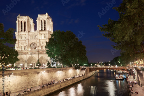 Notre Dame at night with people, Paris © andersphoto