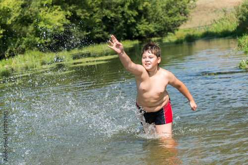 Full 10 years boy swim in  river