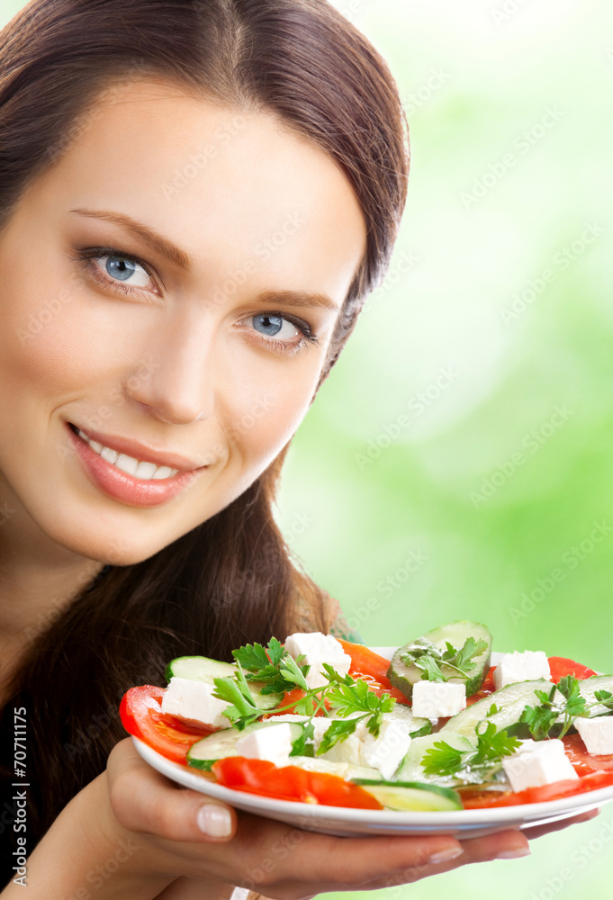 Portrait of happy smiling woman with plate of salad Portrait of happy smiling woman with plate of salad