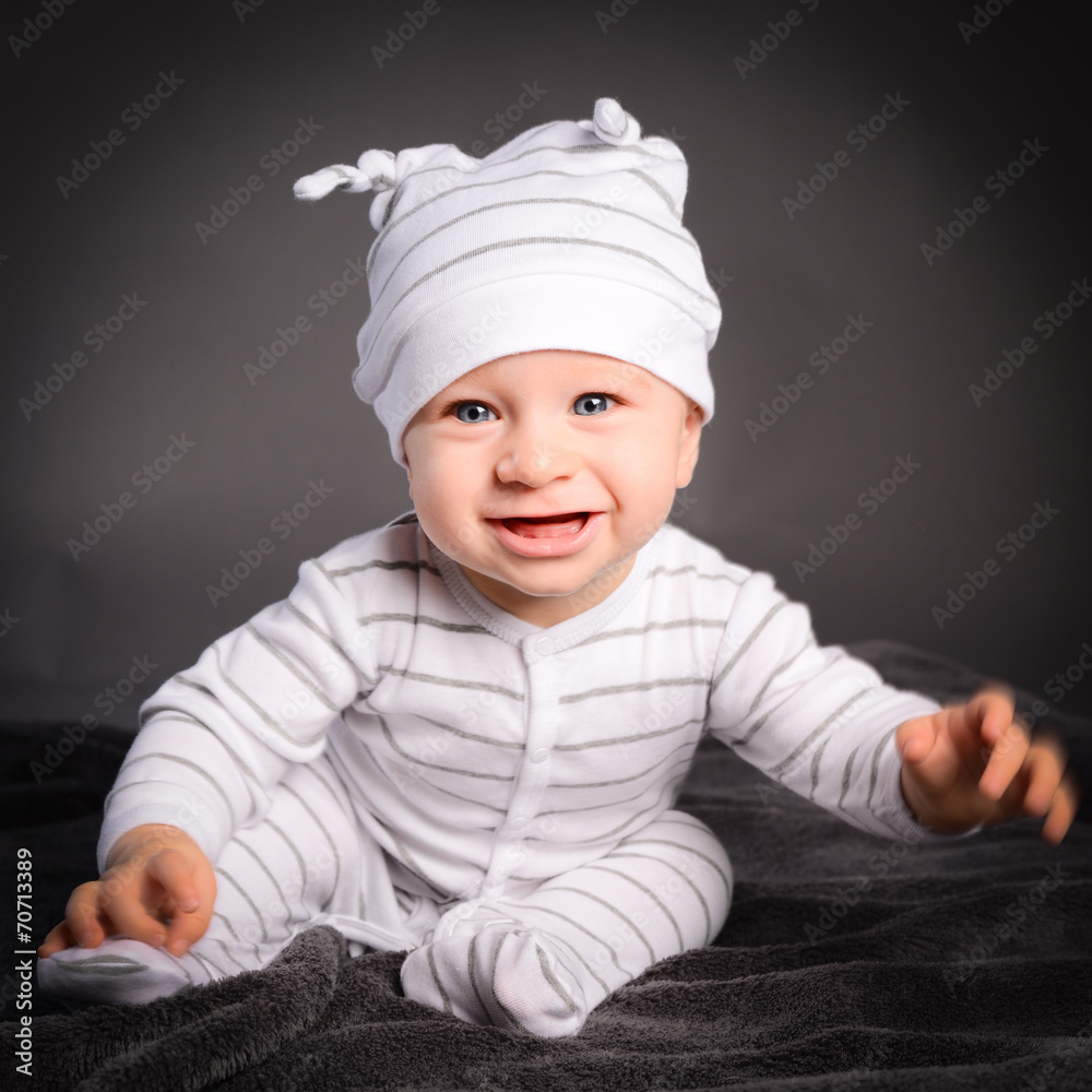 studio portrait on grey background of a lovely toddler baby boy studio portrait on grey background of a lovely toddler baby boy