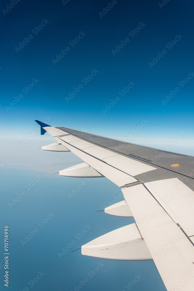 Airplane wing out of window Airplane wing out of window