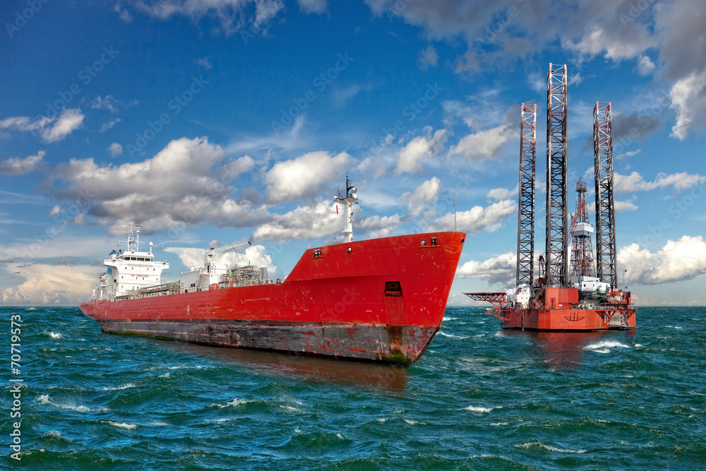 Oil rig and tanker ship on offshore area.