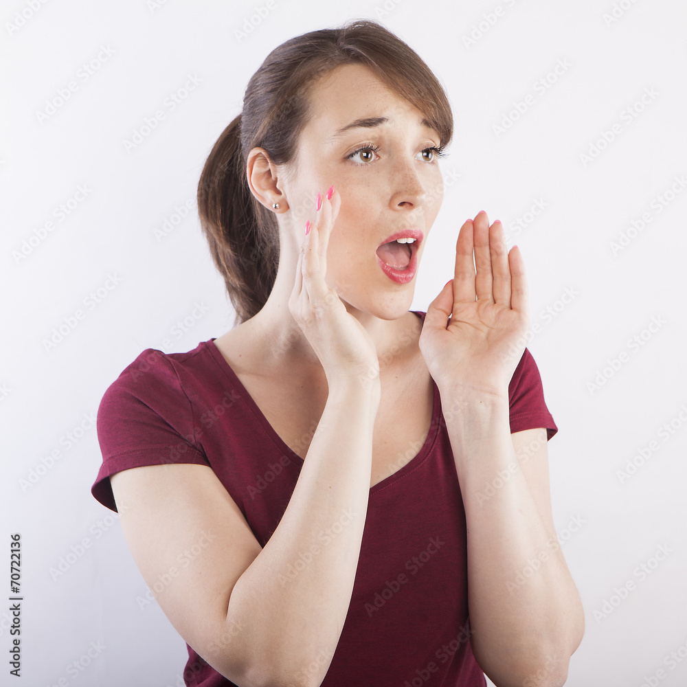 Fototapeta premium young beautiful woman calling loud, screaming